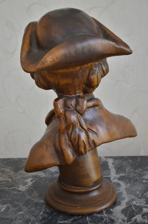 Mezzobusto di fanciullo in legno