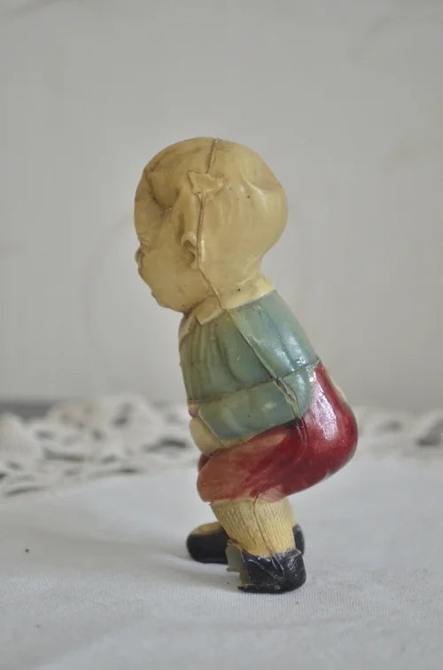 Bimbo giocattolo a carica in celluloide