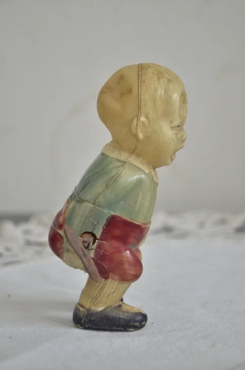 Bimbo giocattolo a carica in celluloide