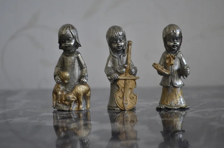 Tre statuine in piombo