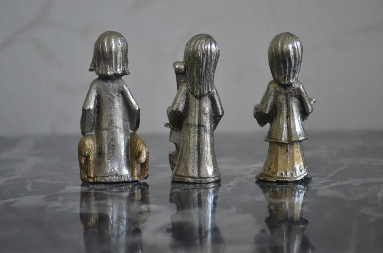 Tre statuine in piombo