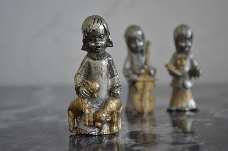 Tre statuine in piombo