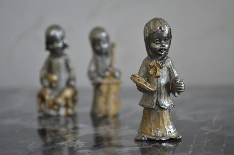 Tre statuine in piombo